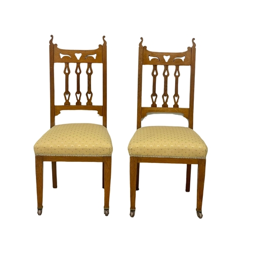 122 - A pair of late Victorian oak high back side chairs. Circa 1900.