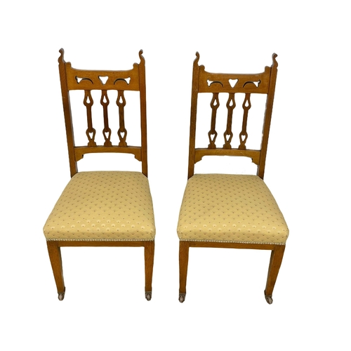 122 - A pair of late Victorian oak high back side chairs. Circa 1900.