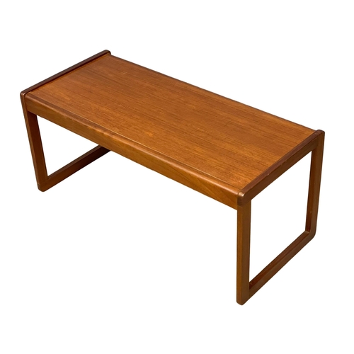 122G - A Mid Century teak coffee table. 96x43x41cm