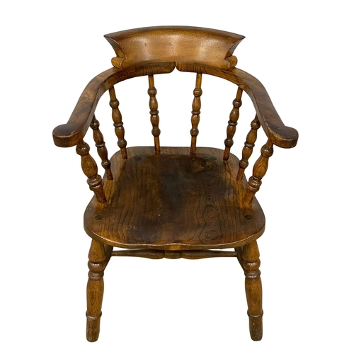 122N - A Victorian Elm and Beech armchair.