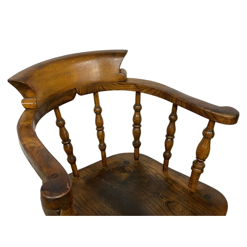 122N - A Victorian Elm and Beech armchair.