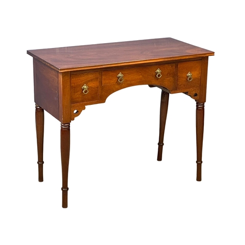 122P - A vintage mahogany writing desk. 91x46x76cm