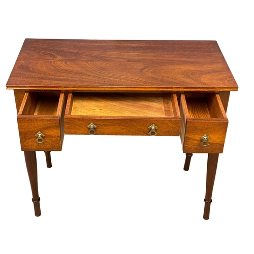 122P - A vintage mahogany writing desk. 91x46x76cm