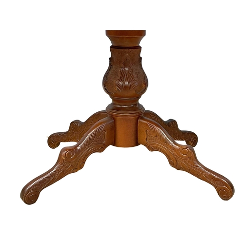 122T - A mahogany pedestal coffee table. 91x61x52cm