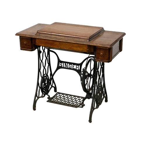 270P - A vintage Singer Sewing machine table. 91x44x77cm