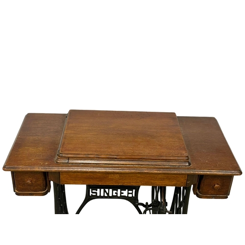 270P - A vintage Singer Sewing machine table. 91x44x77cm