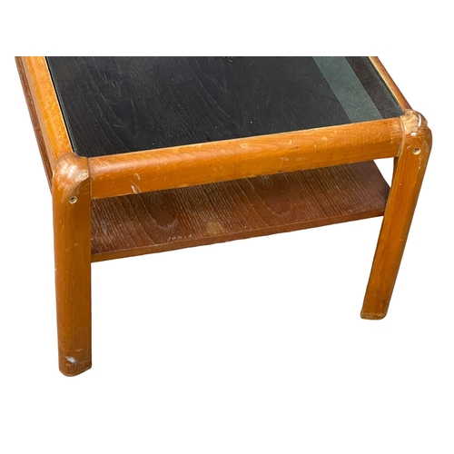 270F - A Nathan Mid Century teak 2 tier coffee table with smoked glass top. 107x49x36cm