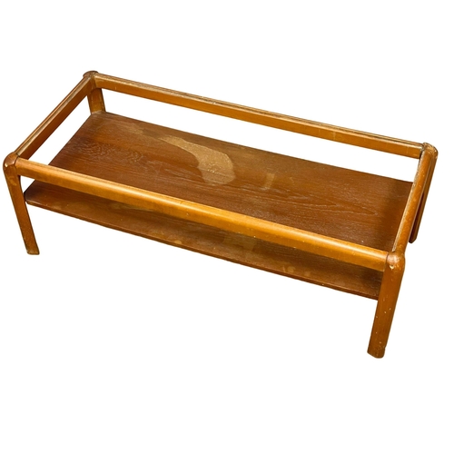 270F - A Nathan Mid Century teak 2 tier coffee table with smoked glass top. 107x49x36cm