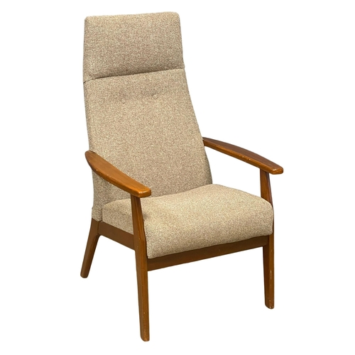 270K - A vintage high back beech framed armchair.