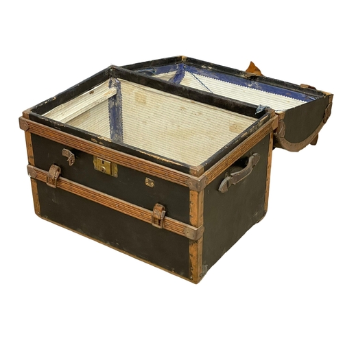 281K - An early 20th century dome top leather and wooden trunk. Circa 1900-1920. 70x49x59cm