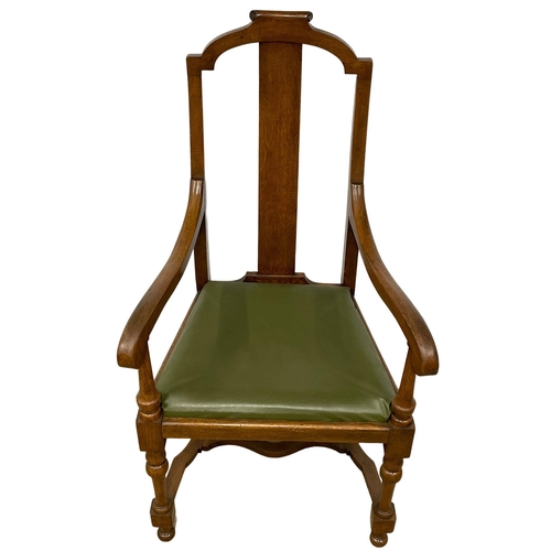 374B - A large early 20th century oak and beech armchair with leather seat. Circa 1920.