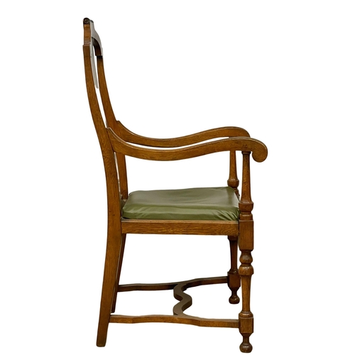 374B - A large early 20th century oak and beech armchair with leather seat. Circa 1920.