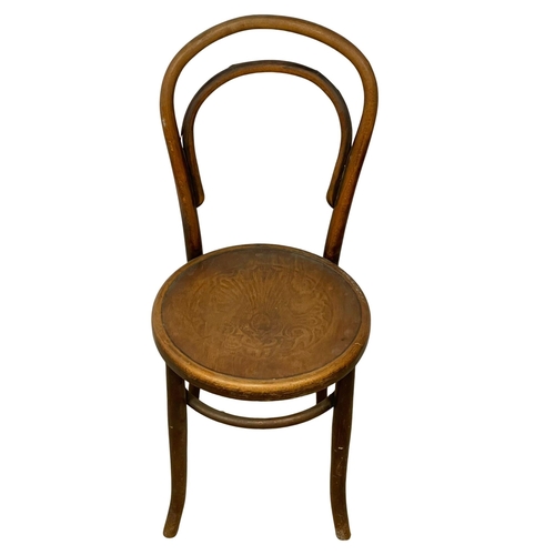 374C - An early 20th century Bentwood chair by Fischell with Pokerwork seat