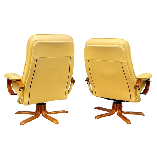 374D - A pair of leather armchairs with matching stools.