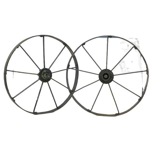 61 - A pair of large 19th century steel wagon wheels. 112cm