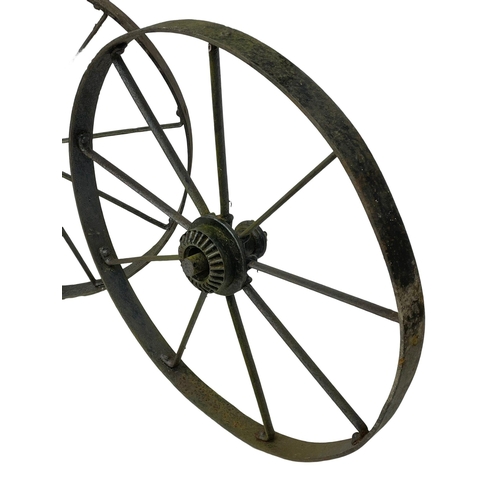 61 - A pair of large 19th century steel wagon wheels. 112cm