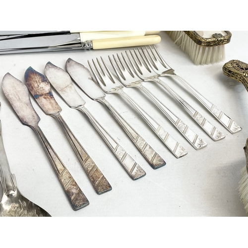 776 - A quantity of silver plated cutlery and a 3 piece vintage brass vanity set.