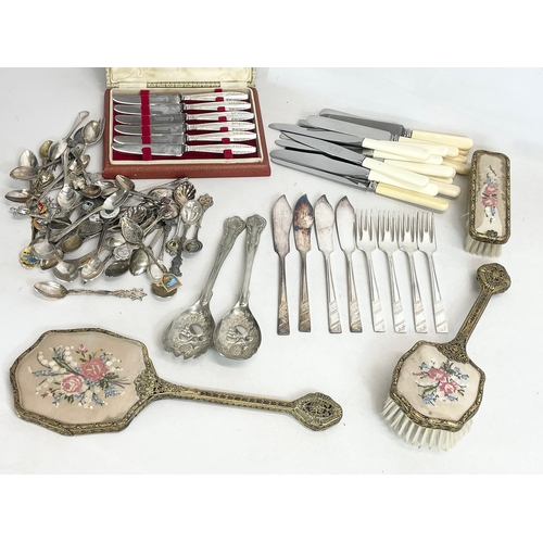 776 - A quantity of silver plated cutlery and a 3 piece vintage brass vanity set.