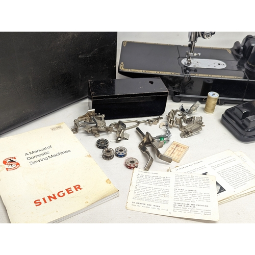 56 - A rare Singer Featherweight sewing machine 222K. Serial number EJ618431, allocated 31 March 1954.