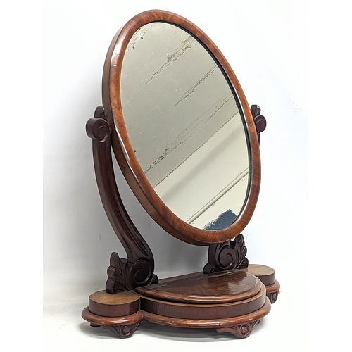 58A - A Victorian mahogany dressing mirror. 59x79cm