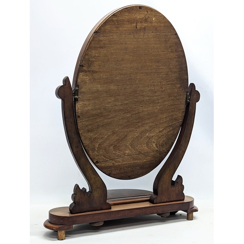 58A - A Victorian mahogany dressing mirror. 59x79cm