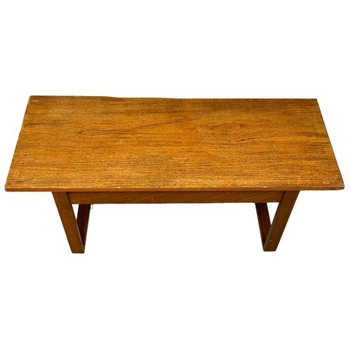 122M - A Mid Century teak coffee table. 101x40x43cm