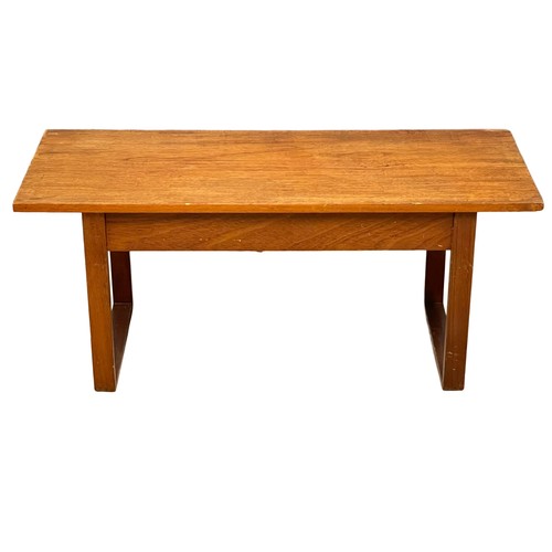 122M - A Mid Century teak coffee table. 101x40x43cm