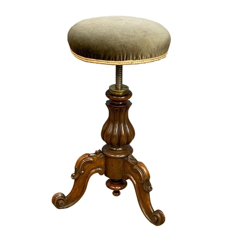 1108 - A Victorian carved Rosewood telescopic piano stool.