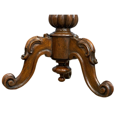 1108 - A Victorian carved Rosewood telescopic piano stool.