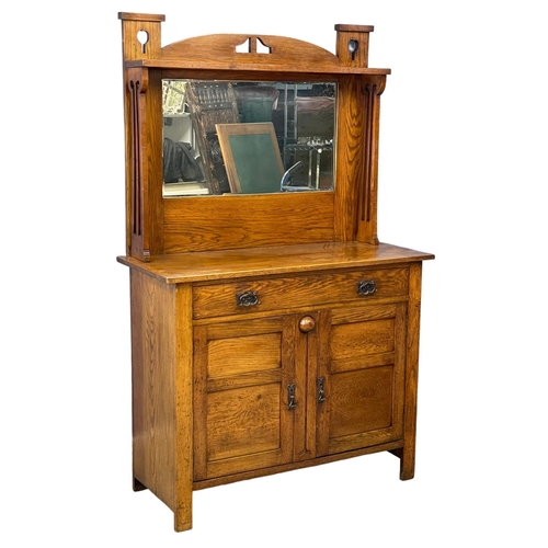 1111 - A late 19th century Arts & Crafts oak mirror back sideboard. Circa 1890. 122x51x194cm