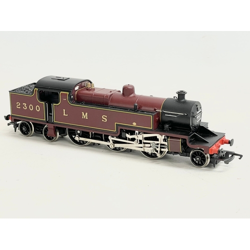 66 - A Hornby Railways OO Gauge Scale Model. LMS class 4P 2-6-4 Tank with crew and vacuum pipes. Box meas... 