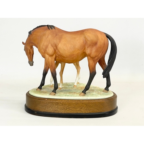 416 - A large Royal Worcester ‘Prince’s Grace & Foal’ on wooden stand. 26x18x24cm