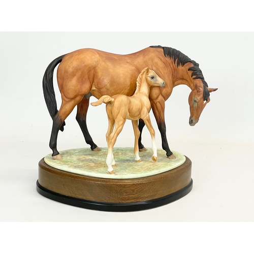 416 - A large Royal Worcester ‘Prince’s Grace & Foal’ on wooden stand. 26x18x24cm