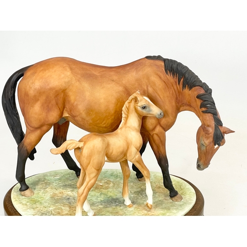 416 - A large Royal Worcester ‘Prince’s Grace & Foal’ on wooden stand. 26x18x24cm