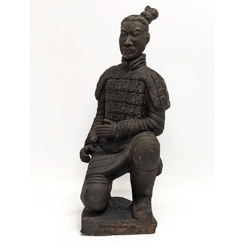 401 - A large early 20th century terracotta Chinese soldier. 35cm