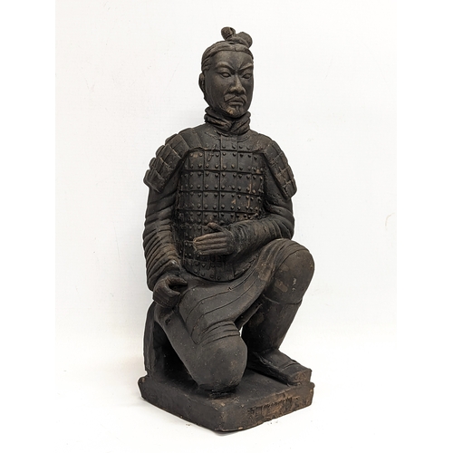 401 - A large early 20th century terracotta Chinese soldier. 35cm