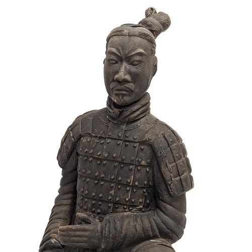 401 - A large early 20th century terracotta Chinese soldier. 35cm