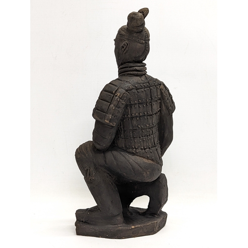 401 - A large early 20th century terracotta Chinese soldier. 35cm