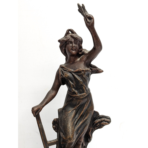 403 - A pair of late 19th century spelter figures on wooden based. 40.5cm