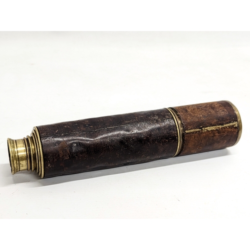 132 - A Victorian leather bound 5 draw telescope by Dollond London. Fully extended 108.5cm