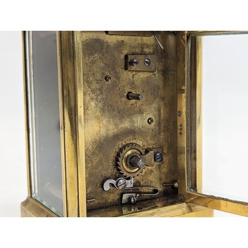 137 - A late 19th century brass carriage clock with key.