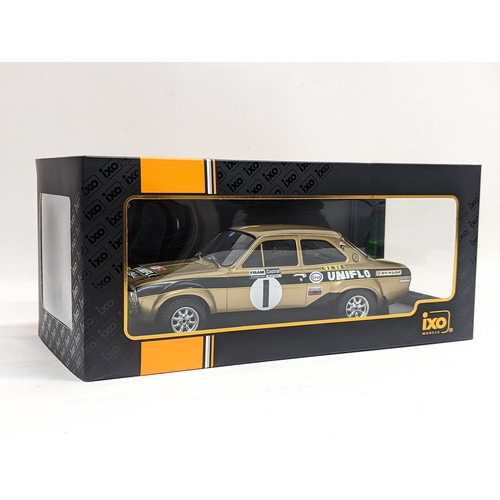 76 - An IXO model of Ford Escort MK1 RS 1600 #1, R. Clark - J. Porter, Welsh Rally 1972. 30.5cm with base... 