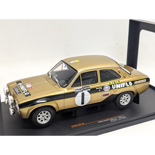 76 - An IXO model of Ford Escort MK1 RS 1600 #1, R. Clark - J. Porter, Welsh Rally 1972. 30.5cm with base... 