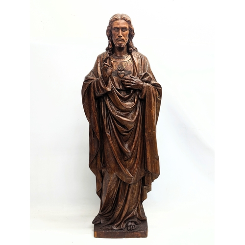 140 - A large 19th century carved limewood figure of Jesus Christ, with polychrome finish. 110cm