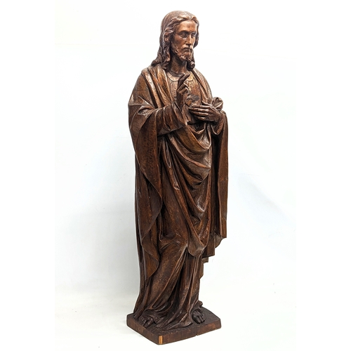 140 - A large 19th century carved limewood figure of Jesus Christ, with polychrome finish. 110cm