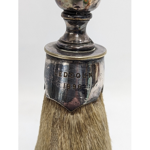145 - A late 19th century silver plate and taxidermy deer's hoof candlestick, engraved Ledgoun 1896. 21.5c... 