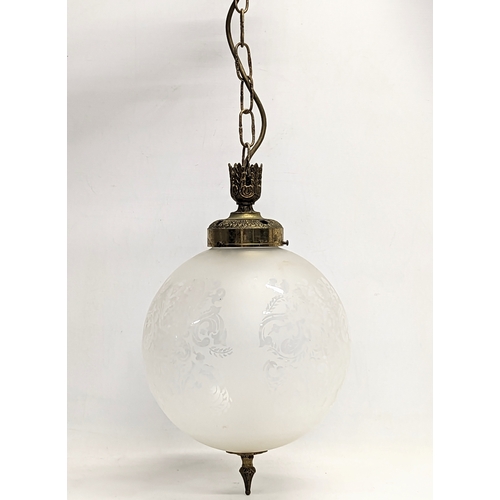 147 - A vintage etched glass light globe. 64cm