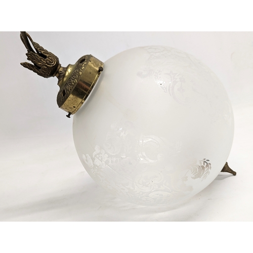 147 - A vintage etched glass light globe. 64cm