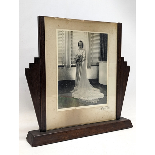 151 - A pair of large 1920s Art Deco photo frames. 32x30cm