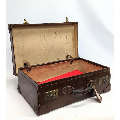 155 - An early 20th century leather case. 58x36x18cm